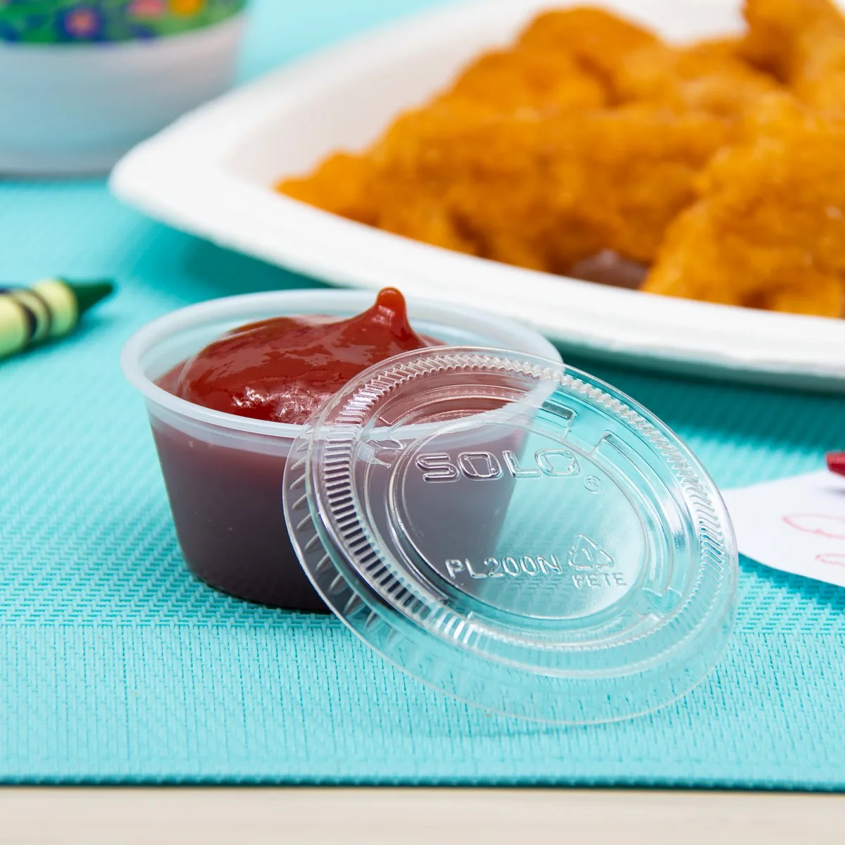 Dart Solo PL200N Medium Ultra Clear Plastic Souffle Cup Lid for 2 oz. Portion Cups - 125/bag - Image 2