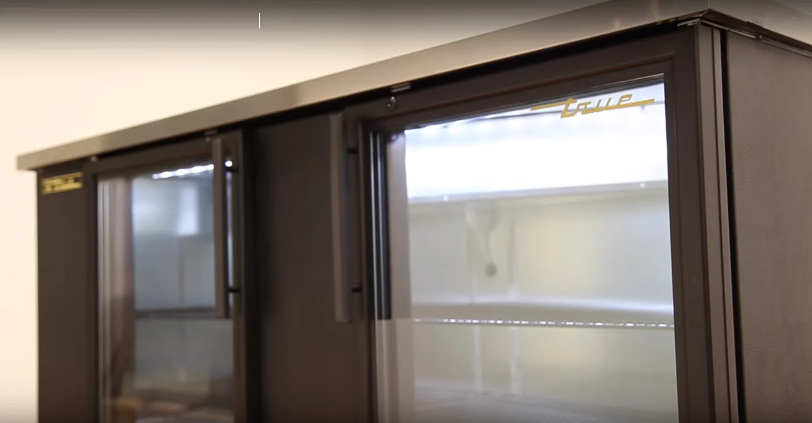 True TBB-4G-HC-LD Black 3 Glass Swing Door Back Bar Refrigerator 90"- Holds (152) 6-packs or (4) Half Barrels - 115v - Image 3